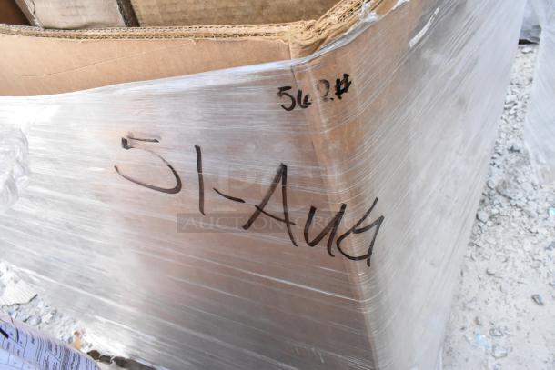 Pallet with cardboard boxes wrapped in plastic, marked "51-Aug" and "562#," containing scratch and dent items.