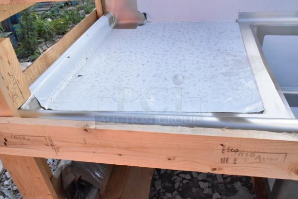 BRAND NEW 2024 Elkay stainless steel 3 bay sink with dual drain boards, scratch and dent, shown in wooden crate packaging.