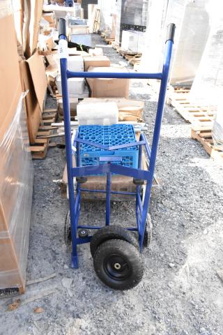 BRAND NEW Blue Metal Barrel Dolly, minor scratches, dual wheels, durable frame, ideal for heavy-duty transport.