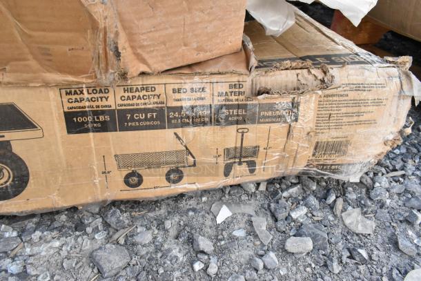 Cardboard box with visible product specs for a steel utility cart, 1000 lbs capacity, 7 cu ft size. Box is slightly damaged.