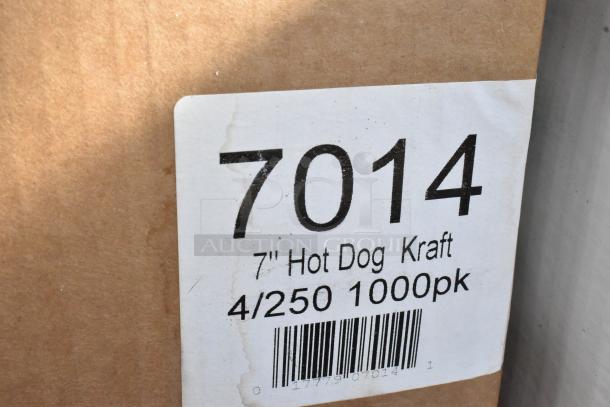 Brown box with a label showing "7014 7-inch Hot Dog Kraft, 4/250 1000pk," indicating a bulk pack of hot dog holders.