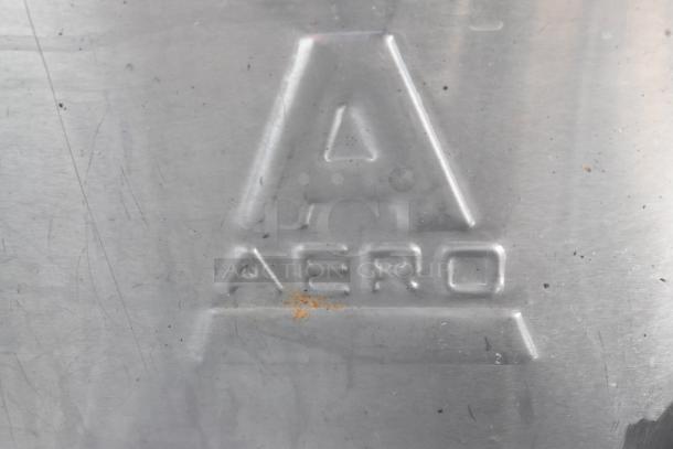 Aero brand stainless steel marking on a 3 bay sink with left side drain board, showing minor wear and orange discoloration.