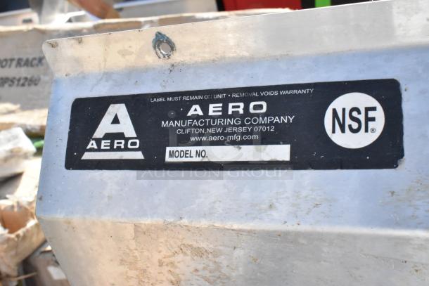 Stainless steel 3 bay sink with left side drain board. Aero Manufacturing label shows NSF certification, good condition.