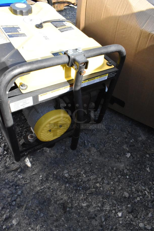 2016 Champion 100222 Portable Generator, yellow and black, sturdy frame, visible engine components, in used condition.