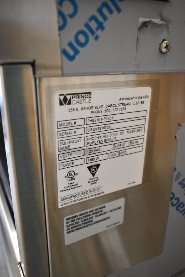 Prince Castle PHB21N1-PLK01 stainless steel holding bin, new. 120V, 1 phase, with labels showing model and specs.