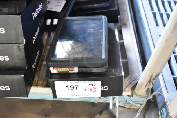 Three tablets with protective cases on a shelf, labeled "Postmates." Auction tag shows "197" and "Qty x3."