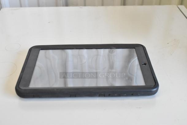 Black tablet with a reflective screen, in used condition, featuring a protective bumper case. No visible labels or markings.
