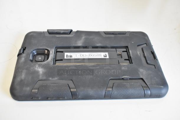 Black rugged tablet case with visible wear and label "T-DD-00588." Includes three tablets.
