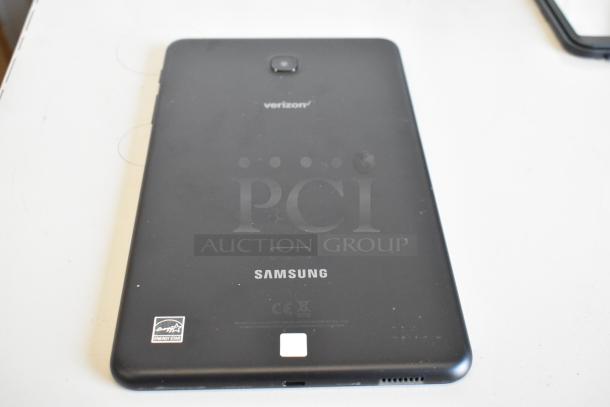 Samsung tablet, Verizon branding, black, Energy Star label, minor wear; part of a lot of three tablets, multiple uses.