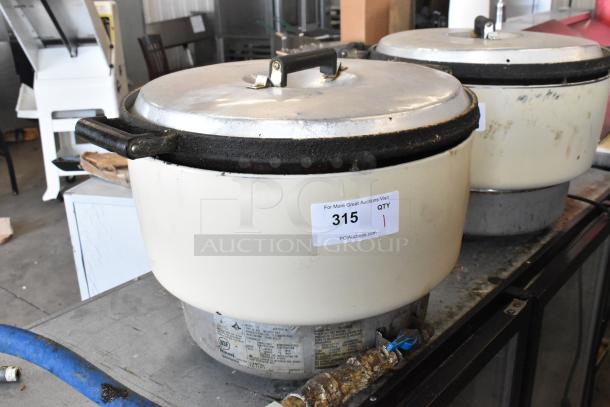 Rinnai RER-55AS-N countertop natural gas rice cooker, used condition, visible labels and markings indicating model and auction details.