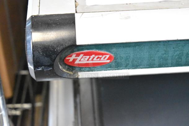 Hatco Metal Commercial Countertop 2 Tier Warming Display Case, 115 Volts, 1 Phase, partial view showing logo.