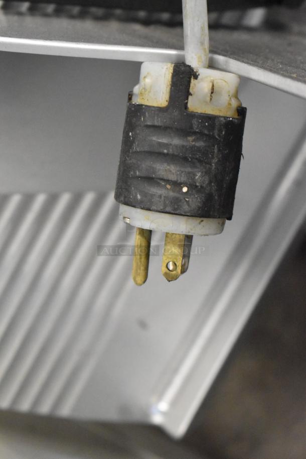 Bizerba GSP H metal meat slicer, voltage 115V, 1 phase, close-up of power plug, used condition.