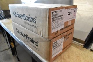 Two new KitchenBrains Fast Z040120HFC Timers in original boxes, with model, serial numbers, and auction label visible.