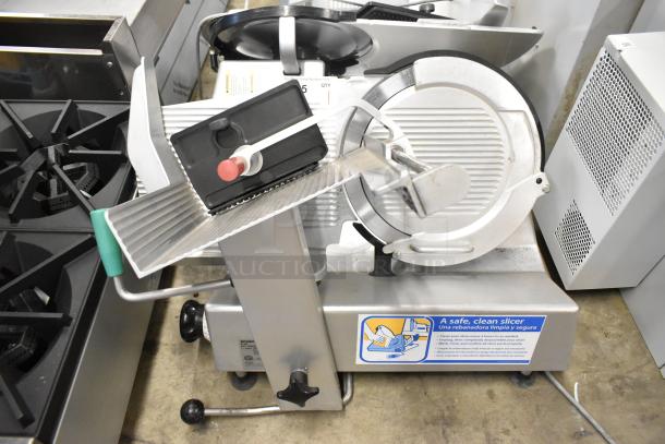 2016 Bizerba GSP H commercial meat slicer, 115V, 1 Phase, in good condition. Features stainless steel blade and safety instructions label.