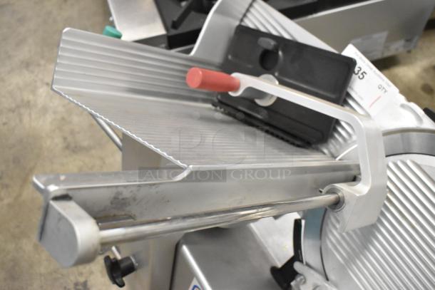 2016 Bizerba GSP H commercial meat slicer, metal body, red handle, 115 volts, 1 phase, in good condition.