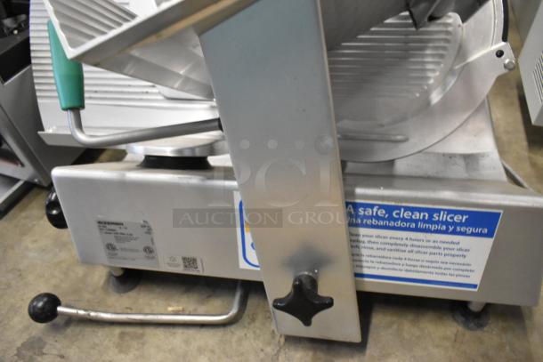 2016 Bizerba GSP H metal commercial meat slicer, 115 volts, 1 phase, with safety and cleaning instructions label.