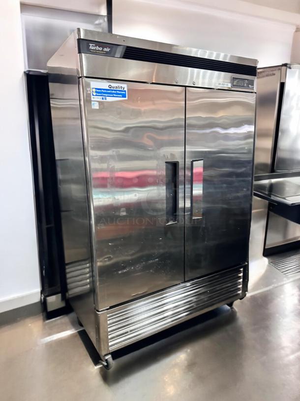 Turbo Air TSR-49SD two-door stainless steel refrigerator in excellent condition, with quality and warranty labels, fully tested and working.