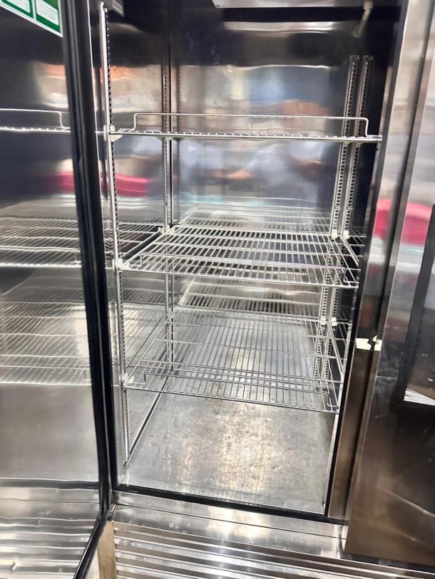 Turbo Air TSR-49SD two-door reach-in refrigerator in excellent condition, featuring stainless steel interior and adjustable wire shelves.