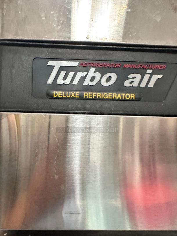 Turbo Air TSR-49SD two-door refrigerator, excellent condition, fully tested, visible "Deluxe Refrigerator" label.