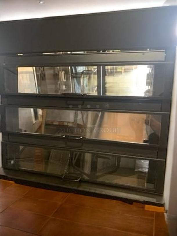 Nemco 6480 Hot Food Display Merchandiser in excellent condition, with multiple clear shelves and a black frame. Fully tested and working.