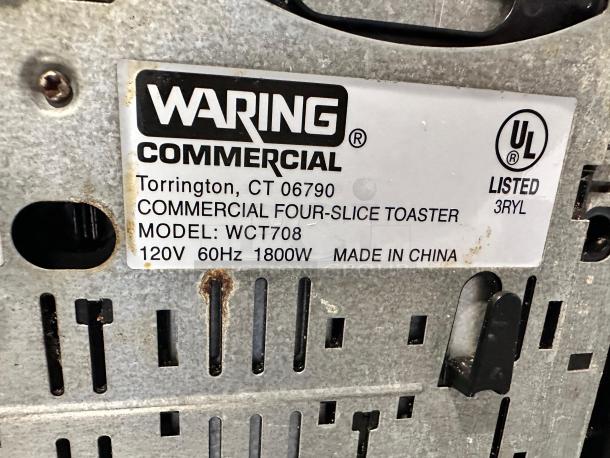 Waring Commercial WCT708 Four-Slice Toaster label, 1800W, excellent condition, model info and UL listed marking visible.