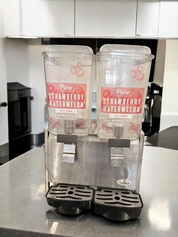 Crathco D25-3 Beverage Dispenser with dual 5-gallon bowls, in excellent condition, visible "Strawberry Watermelon" labels.