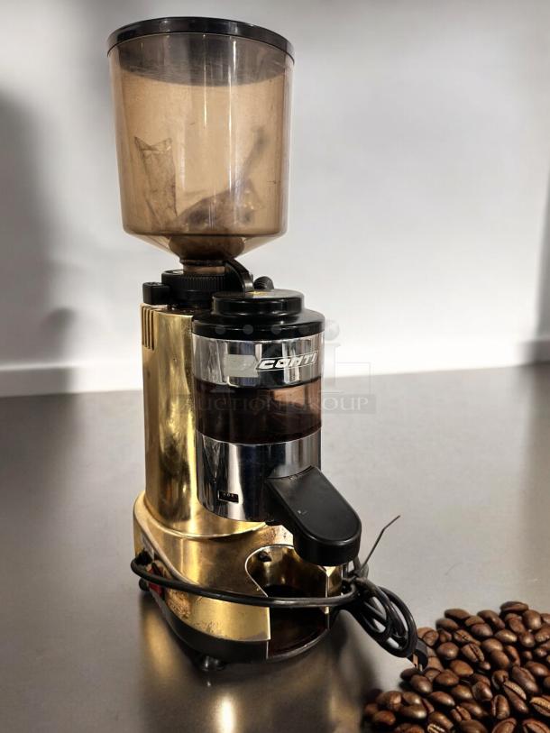 Conti RR45 espresso grinder in excellent condition, gold finish, Italy-made. Fully tested and working, coffee beans pictured.