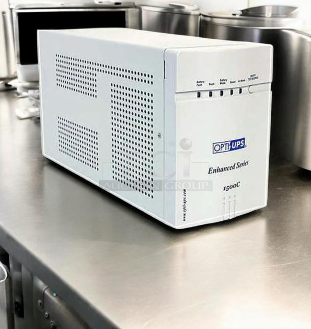 OPTI UPS Enhanced Series 1500C, 980W, excellent condition, tested and working; features front panel LEDs and vented design.