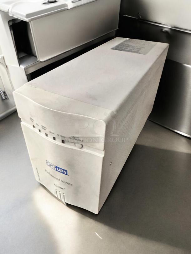 OPTI UPS Enhanced Series 1500C, model ES1500C, in excellent condition. Fully tested, 980W capacity, visible branding.