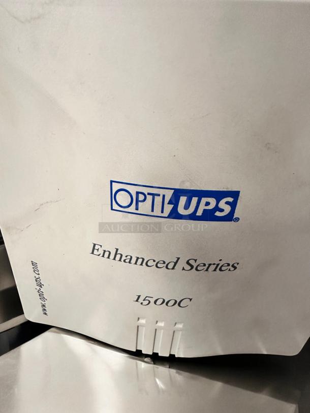 OPTI UPS Enhanced Series 1500C, model ES1500C, 980W. Excellent condition, fully tested and working. Visible logo, model number.