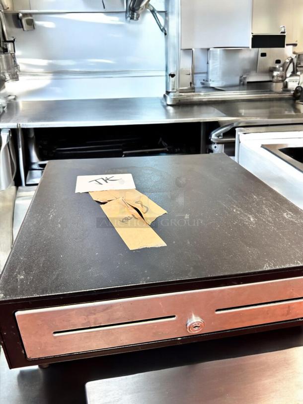 APG Cash Drawer VBS579-BL1616 in excellent condition, black, fully tested and working, with key slot visible.