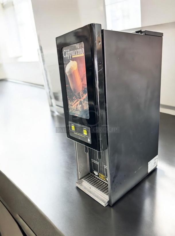 Curtis Primo Cappuccino Dispenser PC2D-10-02, excellent condition, 2 flavor, fully tested, black, "Rich, Creamy & Delicious" label.