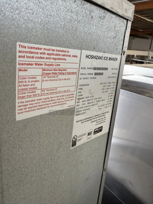 Hoshizaki KM-901MAH ice machine, 950 lb capacity, air-cooled, in great condition. Features visible labels with installation requirements and specifications for 208v, 1PH power.