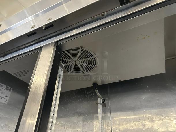True T-43-HC Double Door Reach-In Refrigerator, excellent condition, 115V, fully tested, interior fan and labels visible.