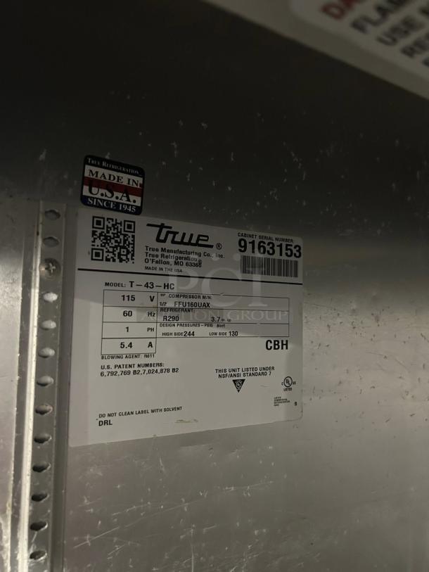 True T-43-HC double door refrigerator label, shows 115V, R290 refrigerant, NSF/ANSI standard. Made in USA. Model details visible.