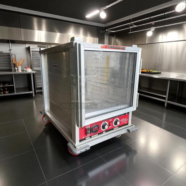 Win-Holt Model NHPL-1810/HN-CA/LC non-insulated heater/proofer cabinet in perfect condition, visible control panel and wheels.