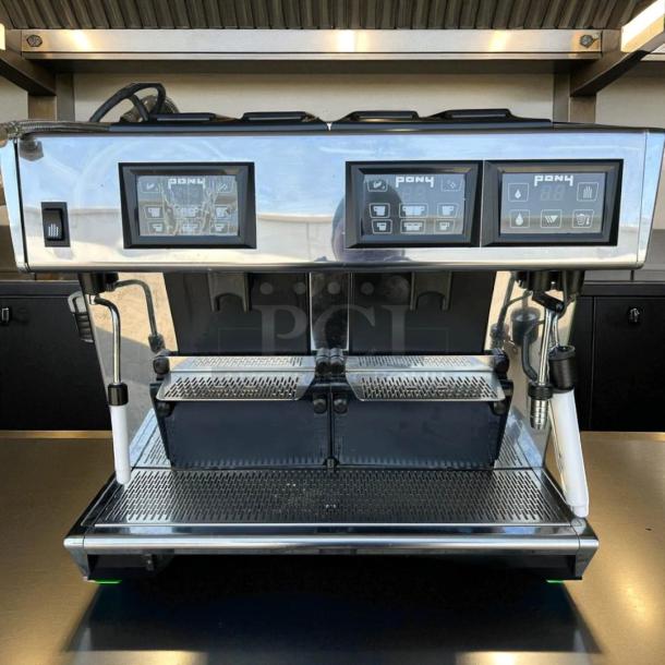 UNIC PONY 4 Super Automatic Espresso Machine, 4 Groups, 2.6 gal Boiler, 230v/1ph, touchscreens visible, excellent condition.