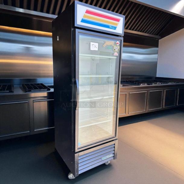 True GDM-23-HC~TSL01 glass door merchandiser, black, 27", right hinge, tested and working, features logo and stickers.
