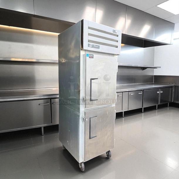 True STA1R-2HS reach-in refrigerator, solid half doors, stainless steel, tested and working, on casters.