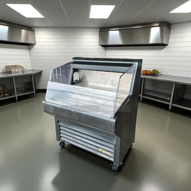 True THAC-36 refrigerated air curtain merchandiser in excellent condition, 115V, fully tested and working, mobile with clear display.