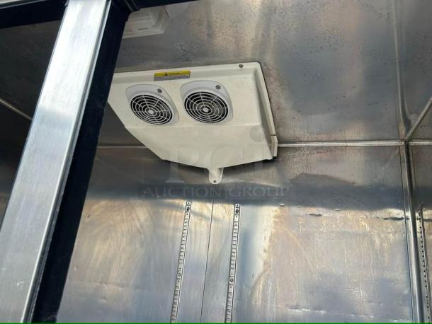 Everest EBSR2 reach-in refrigerator interior, showcasing stainless steel finish, dual fans, and adjustable shelf rails.