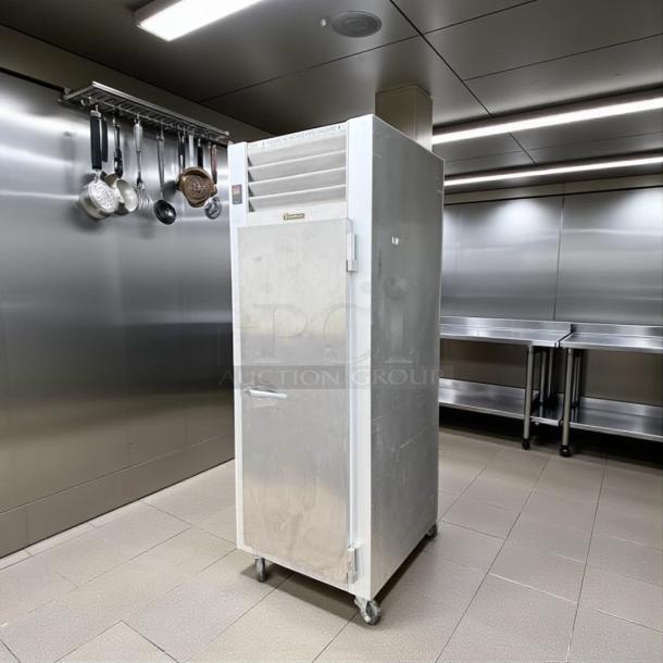 Traulsen Commercial Refrigerator, Model G10010, excellent condition, 115V, fully tested, stainless steel finish, on wheels.