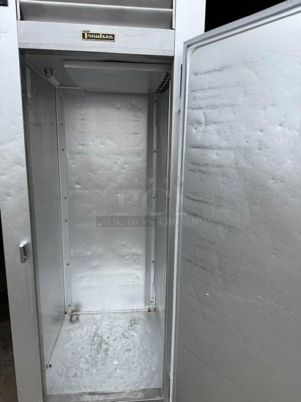 Traulsen G10010 commercial refrigerator, excellent condition, stainless interior, open door, Traulsen logo visible.