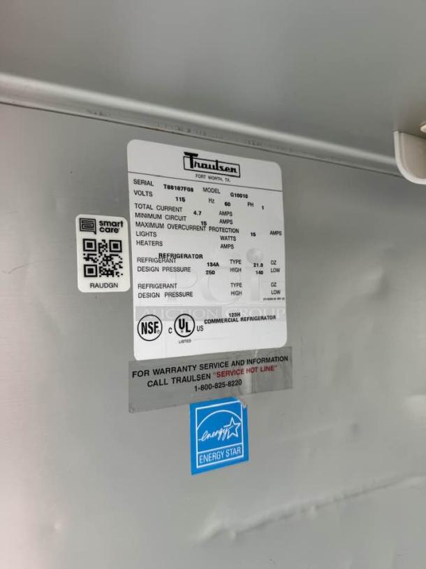 Traulsen Commercial Refrigerator Model G10010, 115V, in excellent condition with Energy Star label and detailed specs visible.