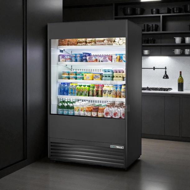 True TAC-48 air curtain merchandiser in excellent condition, 208/230V, stocked with assorted beverages and snacks.