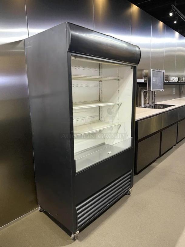 True TAC-48 air curtain merchandiser in excellent condition, 208/230V. Fully tested, black exterior, with adjustable shelves.