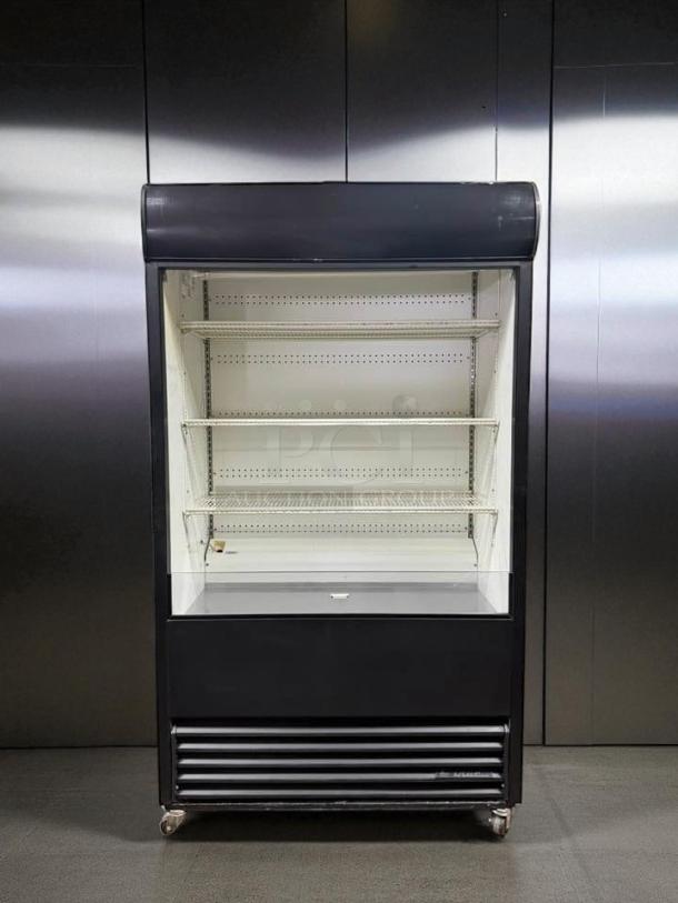 True TAC-48 Air Curtain Merchandiser in excellent condition, 208/230V. Fully tested, features multiple shelves and sleek design.
