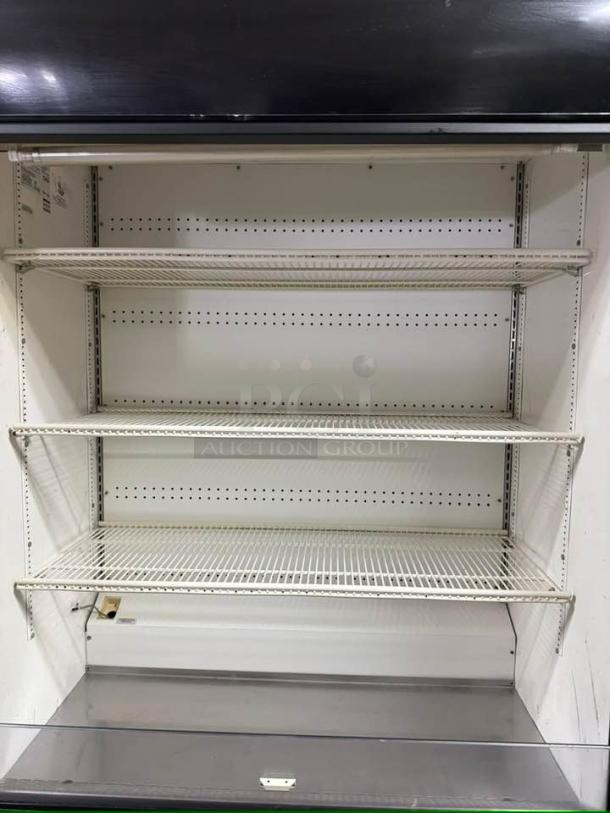 True TAC-48 Air Curtain Merchandiser in excellent condition, fully tested, 208/230V, white shelving, ready for use.