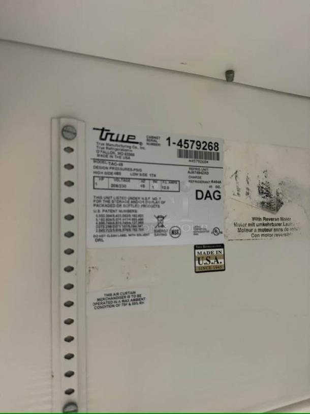 True TAC-48 air curtain merchandiser label showing model, 208/230V, made in USA. Excellent condition, fully tested.