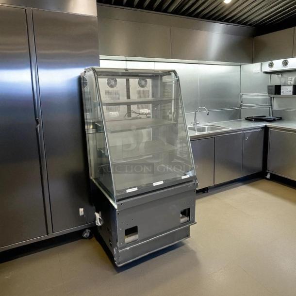 Structural Concepts dry display case in excellent condition, glass front, multiple shelves, tested, and working.